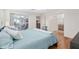 Main bedroom with king bed and access to bathroom and sunroom at 15596 Sw 13Th Cir, Ocala, FL 34473