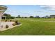 Landscaped backyard with golf course view at 15596 Sw 13Th Cir, Ocala, FL 34473