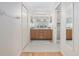 Bathroom with double vanity, large mirrors and separate shower at 15596 Sw 13Th Cir, Ocala, FL 34473