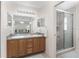 Bathroom with double vanity, large mirrors and separate shower at 15596 Sw 13Th Cir, Ocala, FL 34473