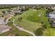 Aerial view of a golf course community with houses and lush landscaping at 15596 Sw 13Th Cir, Ocala, FL 34473
