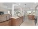 Open concept kitchen with stainless steel appliances and granite countertops at 15596 Sw 13Th Cir, Ocala, FL 34473