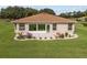 Single-story home with a large sunroom and nicely landscaped yard at 15596 Sw 13Th Cir, Ocala, FL 34473