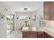 Bright kitchen nook with a table and chairs, offering a view of the backyard at 15596 Sw 13Th Cir, Ocala, FL 34473