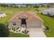 House with brown roof and landscaped yard, viewed from above at 15596 Sw 13Th Cir, Ocala, FL 34473