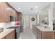 Modern kitchen with stainless steel appliances and granite countertops at 15596 Sw 13Th Cir, Ocala, FL 34473