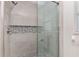 Walk-in shower with modern tile and glass door at 15596 Sw 13Th Cir, Ocala, FL 34473