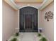 Front entrance with screened porch and decorative metalwork at 15596 Sw 13Th Cir, Ocala, FL 34473