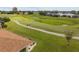 View of a golf course with houses in the background at 15596 Sw 13Th Cir, Ocala, FL 34473