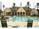Resort-style pool with clubhouse and lounge chairs at 15596 Sw 13Th Cir, Ocala, FL 34473