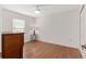 Simple bedroom with hardwood floors and large window at 15596 Sw 13Th Cir, Ocala, FL 34473