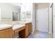 Double vanity bathroom with wood cabinets at 4555 Sw 52Nd Cir # 101, Ocala, FL 34474