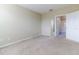 Bedroom with access to bathroom and carpet at 4555 Sw 52Nd Cir # 101, Ocala, FL 34474
