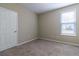 Simple bedroom with neutral walls and carpet at 4555 Sw 52Nd Cir # 101, Ocala, FL 34474