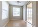 Bright breakfast nook with tile flooring and access to a screened-in patio at 4555 Sw 52Nd Cir # 101, Ocala, FL 34474