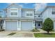 Two-story townhome with two-car garage and landscaped front yard at 4555 Sw 52Nd Cir # 101, Ocala, FL 34474