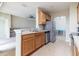 Modern kitchen with wood cabinets and stainless steel appliances at 4555 Sw 52Nd Cir # 101, Ocala, FL 34474