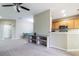 Open concept kitchen with wood cabinets, stainless steel appliances, and breakfast bar at 4555 Sw 52Nd Cir # 101, Ocala, FL 34474