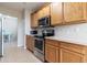 Modern kitchen with stainless steel appliances and ample cabinetry at 4555 Sw 52Nd Cir # 101, Ocala, FL 34474