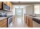 Open concept kitchen with stainless steel appliances and an eat-in area at 4555 Sw 52Nd Cir # 101, Ocala, FL 34474
