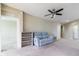 Spacious living room with a ceiling fan and access to a screened-in patio at 4555 Sw 52Nd Cir # 101, Ocala, FL 34474