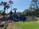 Landscaped pond and waterfall feature at the entrance to Juliette Falls at 7173 Sw 179Th Court Rd, Dunnellon, FL 34432
