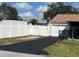 Property boasts a paved driveway and white vinyl fence at 1 Willow Ct, Ocala, FL 34472