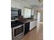 Bright kitchen with ample cabinet space and a view to the dining area at 1 Willow Ct, Ocala, FL 34472