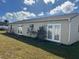 House exterior and spacious backyard with grassy area at 1 Willow Ct, Ocala, FL 34472