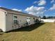 House exterior showcasing a large backyard and double doors at 1 Willow Ct, Ocala, FL 34472