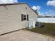 Home's side yard with AC unit and water heater at 1 Willow Ct, Ocala, FL 34472
