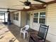 Spacious screened porch with tile flooring and ceiling fans at 1 Willow Ct, Ocala, FL 34472