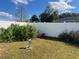 Fenced backyard with lush landscaping and a storage shed at 1 Willow Ct, Ocala, FL 34472