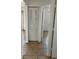 Bright hallway with tile flooring and access to other rooms at 1 Willow Ct, Ocala, FL 34472