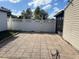 Large backyard patio area with white vinyl fence at 1 Willow Ct, Ocala, FL 34472