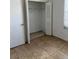 Well-lit bedroom closet with hanging rod and shelving at 1 Willow Ct, Ocala, FL 34472