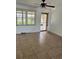 Living room with tile floor, sliding door, and ceiling fan at 1 Willow Ct, Ocala, FL 34472