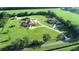Aerial view of expansive estate with multiple buildings and lush landscaping at 1485 & 1525 Se 59Th St, Ocala, FL 34480
