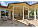 Large covered patio with outdoor kitchen and seating at 1485 & 1525 Se 59Th St, Ocala, FL 34480