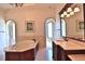 Bathroom features a large soaking tub, dual vanities, and large windows at 1485 & 1525 Se 59Th St, Ocala, FL 34480