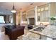 Spacious kitchen with granite counters, custom cabinetry, and large island at 1485 & 1525 Se 59Th St, Ocala, FL 34480