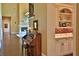 Elegant hallway with hardwood floors and views into the living room at 1485 & 1525 Se 59Th St, Ocala, FL 34480