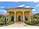 Elegant home entrance with arched entryway and columns at 1485 Se 59Th St, Ocala, FL 34480