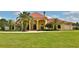Grand estate home with red tile roof and palm trees at 1485 Se 59Th St, Ocala, FL 34480