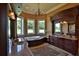 Primary bathroom with soaking tub, double vanity, and granite countertops at 1485 Se 59Th St, Ocala, FL 34480