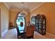 Formal dining room featuring a chandelier and large windows at 1485 Se 59Th St, Ocala, FL 34480