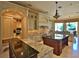 Open kitchen with two islands, custom cabinetry and granite countertops at 1485 Se 59Th St, Ocala, FL 34480