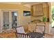 Outdoor kitchen with stainless steel appliances and seating area at 1485 Se 59Th St, Ocala, FL 34480