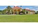 Mediterranean style home with red tile roof and palm trees at 1485 Se 59Th St, Ocala, FL 34480