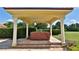 Hot tub with covered patio and lush landscaping at 1485 Se 59Th St, Ocala, FL 34480